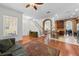 Spacious living room with hardwood floors and an open view into the kitchen at 6922 Duffy Ln, Tampa, FL 33616