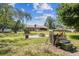 Expansive backyard with a fire pit, wood storage, and room to entertain at 6938 Coronet Dr, New Port Richey, FL 34655