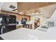Open kitchen offers stone countertops and plenty of cabinet space at 6938 Coronet Dr, New Port Richey, FL 34655