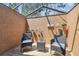 Cozy enclosed patio area with wooden deck, seating, and a partial glass ceiling for natural light at 6938 Coronet Dr, New Port Richey, FL 34655