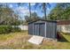 Backyard storage shed with ramp for easy access at 6938 Coronet Dr, New Port Richey, FL 34655