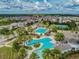 Aerial view highlighting the community's swimming pools, tennis courts, and Gathering-friendly environment at 7207 Peregrina Loop, Wesley Chapel, FL 33545