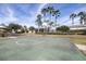 Outdoor basketball court surrounded by trees, perfect for sports and recreation at 7207 Peregrina Loop, Wesley Chapel, FL 33545