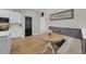 Charming breakfast nook with banquette seating and adjacent kitchen area at 7207 Peregrina Loop, Wesley Chapel, FL 33545