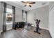 Exercise room with workout equipment, natural light, and access to the outdoors at 7207 Peregrina Loop, Wesley Chapel, FL 33545