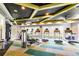 Well-equipped gym with treadmills, weight machines, and natural light, promoting a healthy lifestyle at 7207 Peregrina Loop, Wesley Chapel, FL 33545