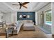 Inviting living room with hardwood floors, cozy sectional sofa, and sliding glass doors to the outdoor pool area at 7207 Peregrina Loop, Wesley Chapel, FL 33545