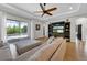 Relaxing living room with television, access to the outdoor pool area, and comfortable seating at 7207 Peregrina Loop, Wesley Chapel, FL 33545