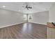 Large living room with hardwood flooring, a ceiling fan, recessed lighting, and lots of natural light at 7207 Peregrina Loop, Wesley Chapel, FL 33545