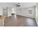 A large living room offers hardwood flooring, recessed lighting, and lots of natural light at 7207 Peregrina Loop, Wesley Chapel, FL 33545