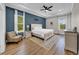 Spacious main bedroom with tray ceiling, neutral walls and natural light showcasing an inviting and serene atmosphere at 7207 Peregrina Loop, Wesley Chapel, FL 33545