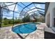 This in-ground pool features a screened-in lanai and paver deck at 7207 Peregrina Loop, Wesley Chapel, FL 33545