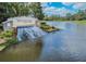 The Watergrass community waterfall feature and neighborhood entrance set on a sunny day at 7207 Peregrina Loop, Wesley Chapel, FL 33545