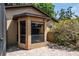 Bay window on exterior of home with brick paver patio and tidy foliage at 740 Crystal Dr, Palm Harbor, FL 34683