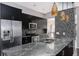 Kitchen features granite countertops, stainless steel appliances and mosaic tile backsplash at 740 Crystal Dr, Palm Harbor, FL 34683
