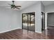 Living room with wood flooring and sliding glass doors to the patio, overlooking a pool at 740 Crystal Dr, Palm Harbor, FL 34683