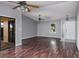 The living room is bright, with wood flooring and a front door to the home's entryway at 740 Crystal Dr, Palm Harbor, FL 34683