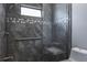 View of the remodeled shower with a built-in bench, mosaic accent tile, and a handheld sprayer at 740 Crystal Dr, Palm Harbor, FL 34683