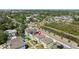 Aerial view of the home with solar panels, deck, and fenced yard at 7509 S Sherrill St, Tampa, FL 33616