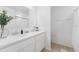 Clean bathroom featuring double sinks, modern fixtures and tile flooring at 7509 S Sherrill St, Tampa, FL 33616