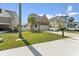 Exterior view of home with well-kept lawn and a concrete driveway at 7509 S Sherrill St, Tampa, FL 33616