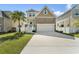 Charming two-story home with stone accents, manicured lawn, and a welcoming entrance at 7509 S Sherrill St, Tampa, FL 33616