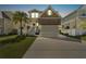 Exterior of home with front lawn and two-car garage at dusk at 7509 S Sherrill St, Tampa, FL 33616