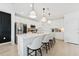 Stylish kitchen with a large center island, stainless steel appliances, and pendant lighting at 7509 S Sherrill St, Tampa, FL 33616