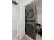 Modern stacked washer and dryer conveniently located near the staircase at 7509 S Sherrill St, Tampa, FL 33616