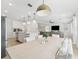 Open concept living space with dining area, kitchen, and a staircase to the second level at 7509 S Sherrill St, Tampa, FL 33616
