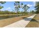 Picturesque walking path alongside a canal offers residents a scenic view in a tranquil outdoor setting at 7509 S Sherrill St, Tampa, FL 33616