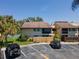 Aerial view of a home with well-maintained landscaping and parking at 782 Village Lake N Ter # 102, St Petersburg, FL 33716