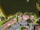 Aerial view of a home next to a tranquil lake with community amenities at 782 Village Lake N Ter # 102, St Petersburg, FL 33716