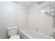 Bright bathroom with a shower and tub featuring white tile and updated chrome fixtures at 782 Village Lake N Ter # 102, St Petersburg, FL 33716