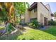 Exterior of a home with lush landscaping and access to tranquil lake at 782 Village Lake N Ter # 102, St Petersburg, FL 33716