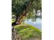 Tranquil lake view framed by mature trees, offering a serene and picturesque setting at 782 Village Lake N Ter # 102, St Petersburg, FL 33716
