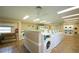 Onsite laundry room with coin-operated washers and dryers for residents' convenience at 782 Village Lake N Ter # 102, St Petersburg, FL 33716
