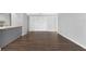 Bright living room features hardwood floors and built-in shelving for ample storage space at 782 Village Lake N Ter # 102, St Petersburg, FL 33716