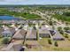 Expansive community aerial featuring modern homes, tranquil ponds, and planned street networks at 8105 Bilston Village Ln, Gibsonton, FL 33534