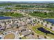 High aerial showing a neighborhood with ponds and well-spaced homes at 8105 Bilston Village Ln, Gibsonton, FL 33534