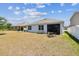 Lawn and view of the house featuring patio at 8105 Bilston Village Ln, Gibsonton, FL 33534