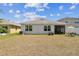 View of backyard with patio, well-maintained lawn, and exterior at 8105 Bilston Village Ln, Gibsonton, FL 33534