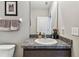 Well-maintained bathroom with a framed mirror and granite counter at 8105 Bilston Village Ln, Gibsonton, FL 33534