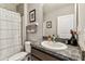 Well-maintained bathroom featuring granite counters and shower with decorative curtain at 8105 Bilston Village Ln, Gibsonton, FL 33534