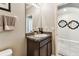 Well-maintained bathroom with a framed mirror and granite counter at 8105 Bilston Village Ln, Gibsonton, FL 33534