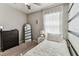 Cozy bedroom featuring soft natural light and modern decor at 8105 Bilston Village Ln, Gibsonton, FL 33534