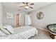 Bright bedroom features a ceiling fan, plush carpet, and decor at 8105 Bilston Village Ln, Gibsonton, FL 33534