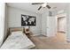 Comfortable bedroom featuring a striking world map and doorway at 8105 Bilston Village Ln, Gibsonton, FL 33534