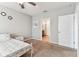 Neutral bedroom with carpet, ceiling fan, and an ensuite bathroom at 8105 Bilston Village Ln, Gibsonton, FL 33534
