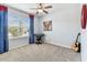 Bedroom with neutral walls, carpeted floor, and large window at 8105 Bilston Village Ln, Gibsonton, FL 33534